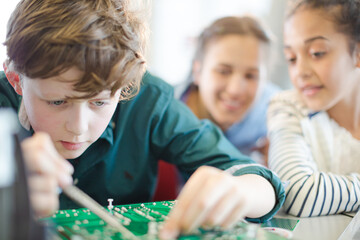 Fototapeta premium Students assembling model in classroom