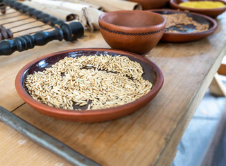 earthenware plate full of rye seeds for baking selective focus