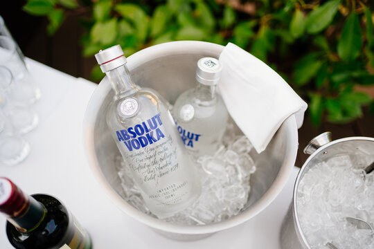 vodka brand absolute in a bucket of ice. cooling of alcoholic beverages. 