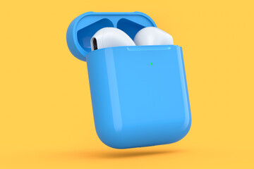 Wireless bluetooth headphones in blue case isolated on orange background