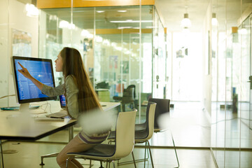 Girl student using computer at desk