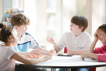 Students sitting together at table