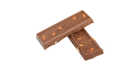 Two pieces of milk chocolate with nuts on a white background