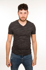 Fototapeta premium portrait isolated caucasian young man with serious expression with arms down