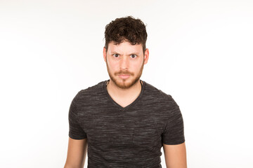 Fototapeta premium portrait isolated caucasian young man with serious expression