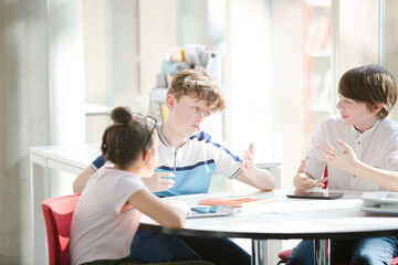 Students sitting together at table