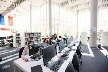 Students working on computers in library