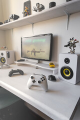 General view home workplace of gamer with computer and gamepad.  © Aboltin