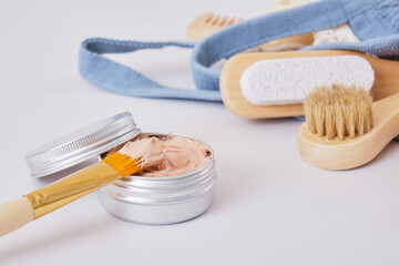 makeup brush and cosmetic red clay in aluminum jar, natural cosmetics and zero waste lifestyle