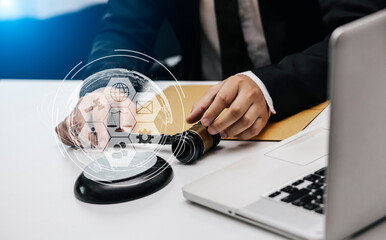 Concepts of Law and Legal services. Lawyer working with law interface icons. Blurred background.