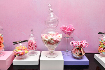 Sweet Jars on a table setting. looks like a sweet shop that's very inviting for teenagers and children