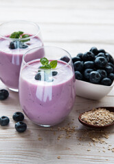 Glasses of blueberry yogurt with blueberries