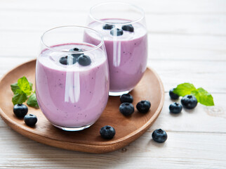 Glasses of blueberry yogurt with blueberries