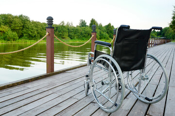 Wheelchair on the river bank