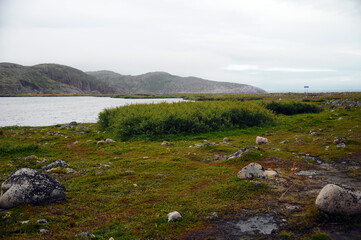 Fototapeta premium karelia, landscape, nature, sky, mountain, mountains, water, summer, river, travel, rock, clouds, sea, lake, grass, view, valley, green, stone, coast, scenic, norway, beautiful, stream, panorama, nort