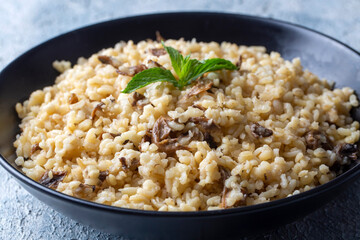 Turkish foods; Bulgur pilaf with mushrooms (Turkish name; mantarli bulgur pilavi)