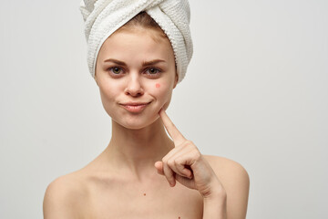 woman with a magnifying glass in hand dermatology isolated background