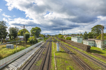 Fototapeta na wymiar Railway platform of the city station in an autumn day. Mozhaysk, Russia