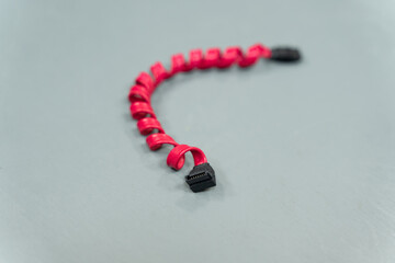 red sata (Serial Advanced Technology Attachment) wire for hard drives and ssd on gray background