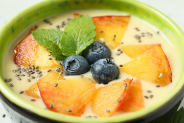 Concept of healthy food with peach yogurt, close up