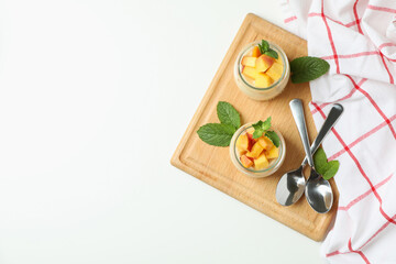 Concept of healthy food with peach yogurt on white background