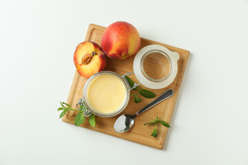 Concept of healthy food with peach yogurt on white background
