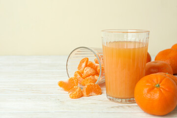 Mandarin jam and ingredients on white wooden table
