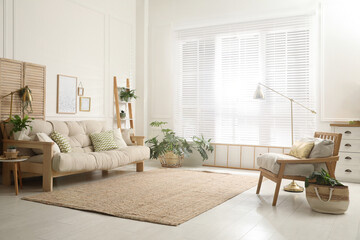 Comfortable sofa and armchair in stylish living room. Interior design