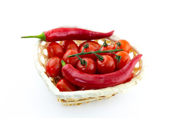 red hot peppers and cherry tomatoes base sauce on white isolated background
