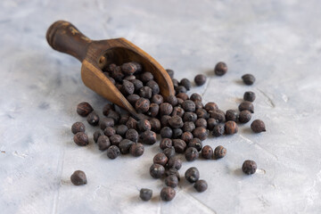 Black chickpea on the wooden scoop closeup