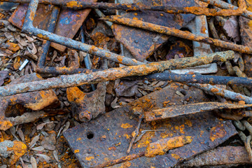steel bar and plate covered with rusty on the ground close up