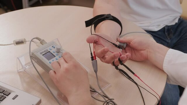 Patient nerves testing using electromyography at medical center