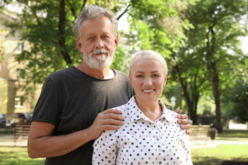 Portrait of lovely mature couple in park