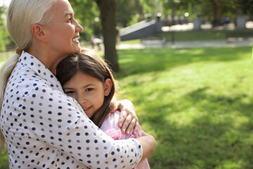 Fototapeta premium Mature woman with her little granddaughter in park