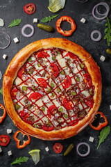 Fresh Homemade Italian Pizza Margherita with olives and red Bulgarian peppers on a dark background