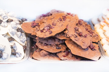 hand made sweets dark chocolate and white close up on isolated background