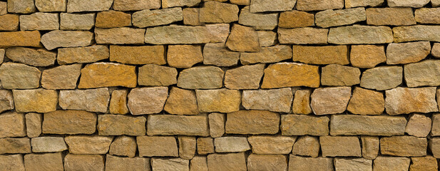 wall of brown old cobblestones background solid, stone