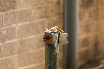improvised ash trap in a municipal parking lot