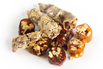 Walnuts on a string dipped in starch grape molasses. Churchkhela. Walnut sujuk.