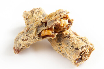 Walnuts on a string dipped in starch grape molasses. Churchkhela. Walnut sujuk.