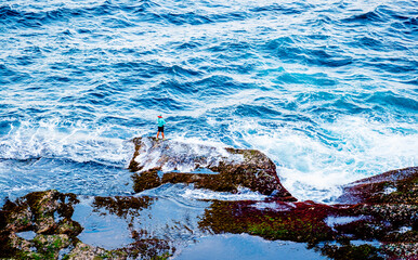 Fishing is believing against high tide