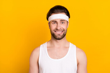 Portrait of attractive worried desperate guy sportsman biting lip expecting isolated over bright yellow color background