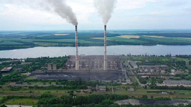 Industrial architecture factory warehouses. Aerial view of big factory territory with huge tubes.