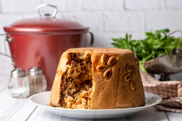 Turkish Perde Pilavi. Drape pilaf with chicken, almond and raisin. A local flavor Rice from Siirt region (Turkish name; Siirt perde pilavi)