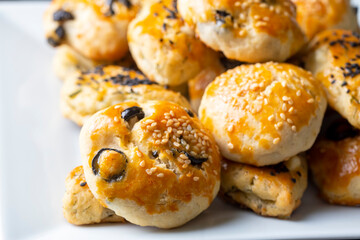 Turkish style pastry with olives and dill cheese pastry (Turkish name; Zeytinli pogaca ve dere otlu peynirli pogaca)