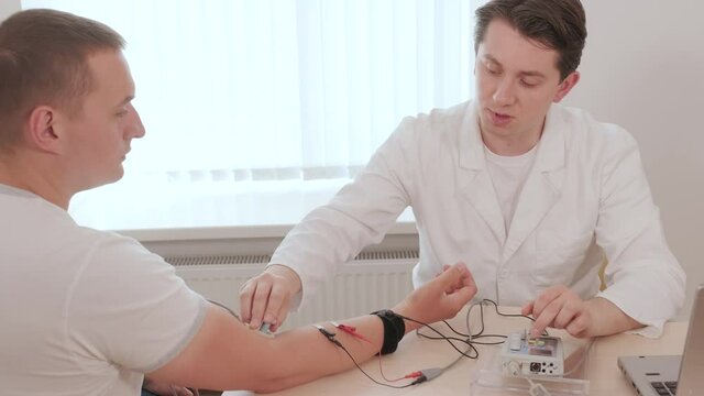 Patient nerves testing using electromyography at medical center
