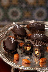 salted date dipped in chocolate with salt sprinkles on top