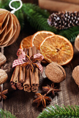 Fototapeta na wymiar Cinnamon sticks and nuts for Christmas baking