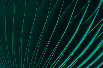 Dark green abstract background, fragment of paper decoration close-up