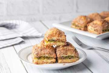 Traditional turkish new dessert cold milky baklava with pistachio (Turkish name; soguk baklava)